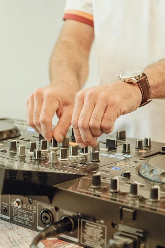 A DJ EQ mixing on the controller