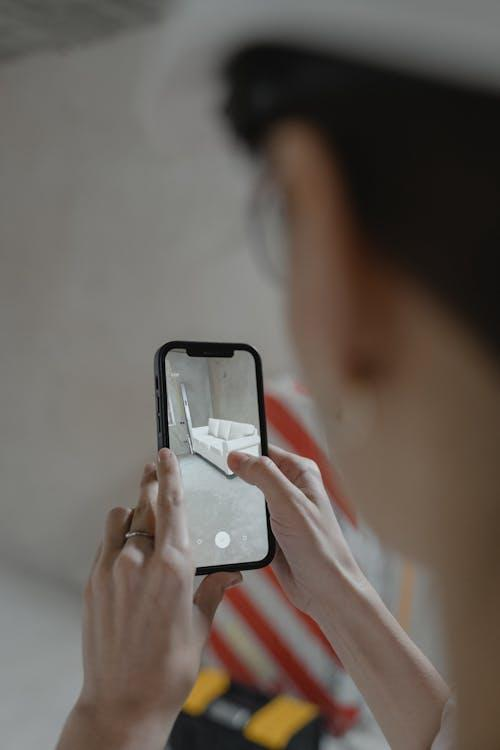 A person using a smartphone to interact with augmented reality at an event