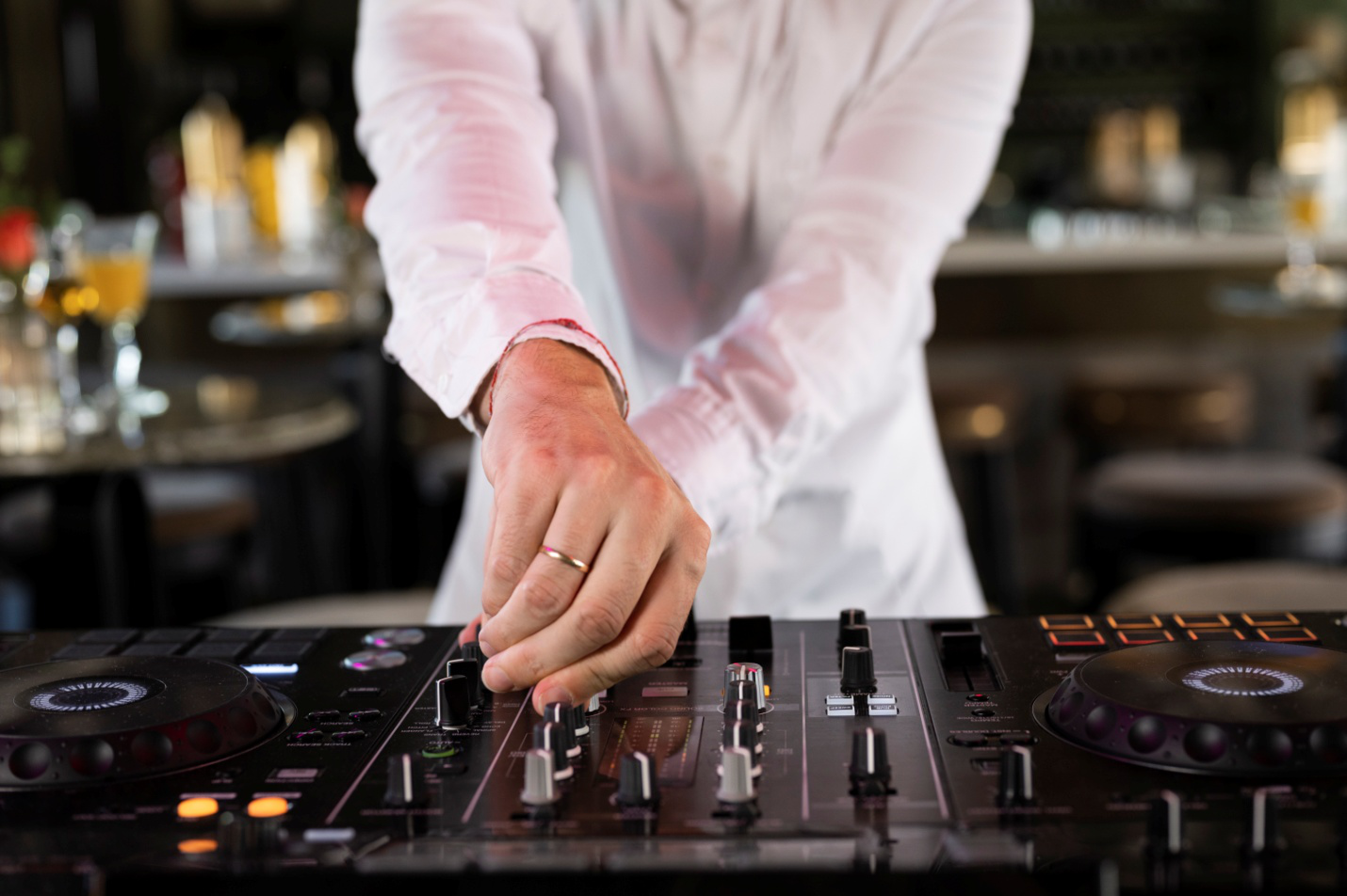 a DJ turning the keys for musical entertainment