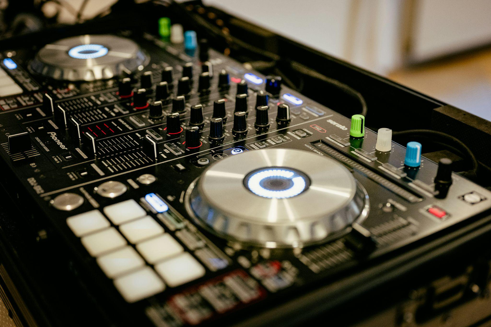 a close-up of a DJ’s mixer